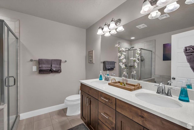 1928 E Vacation Ln, Washington, UT 84780 - bathroom with tile patterned floors, vanity, toilet, and a shower with shower door