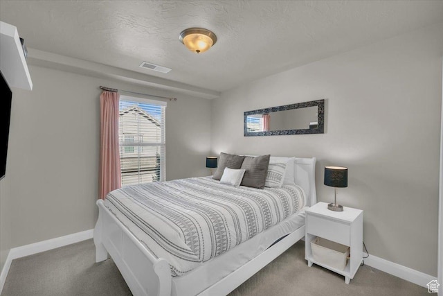 1928 E Vacation Ln, Washington, UT 84780 - carpeted bedroom with a textured ceiling