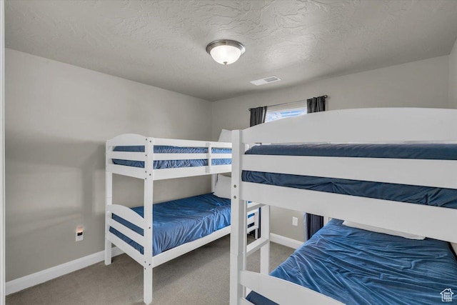 1928 E Vacation Ln, Washington, UT 84780 - bedroom with carpet floors and a textured ceiling