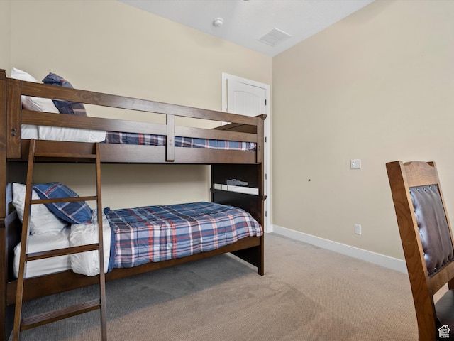 bedroom with baseboards, carpet flooring, and visible vents