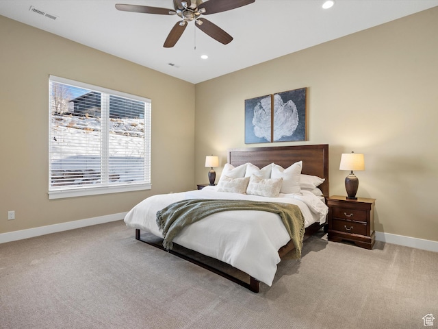 bedroom featuring baseboards, carpet floors, and visible vents