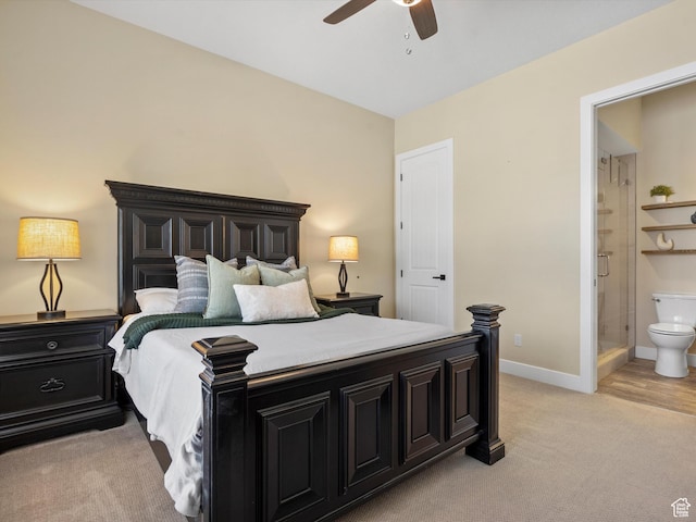 bedroom with connected bathroom, a ceiling fan, baseboards, and light colored carpet