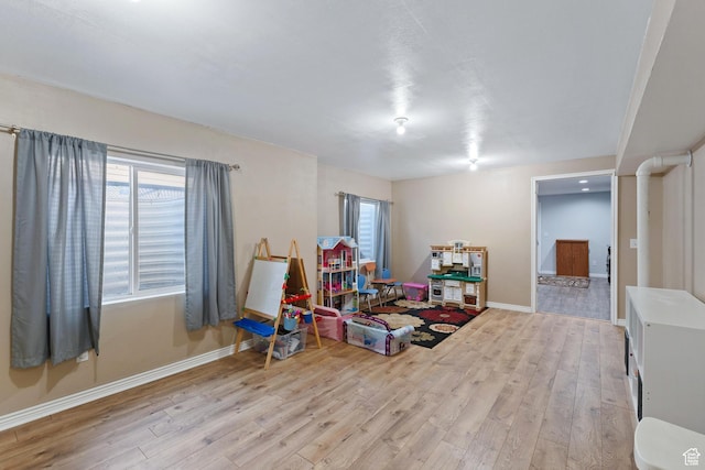 7112 N Mohican Dr E, Eagle Mountain, UT 84005 - recreation room featuring plenty of natural light and light hardwood / wood-style flooring