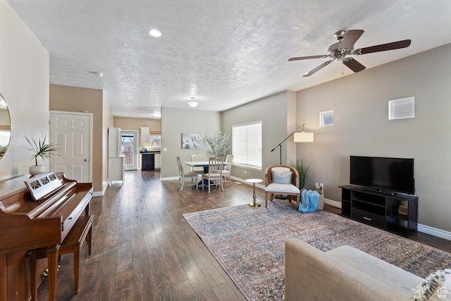 7112 N Mohican Dr E, Eagle Mountain, UT 84005 - living room with a textured ceiling, ceiling fan, a healthy amount of sunlight, and dark hardwood / wood-style floors
