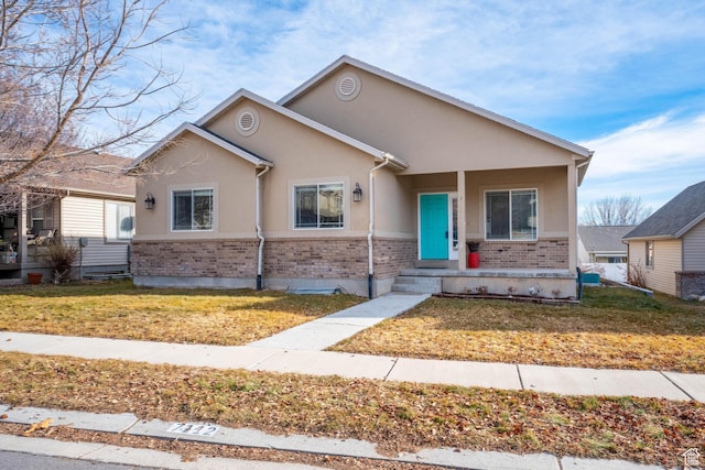view of front of property with a porch and a front yard