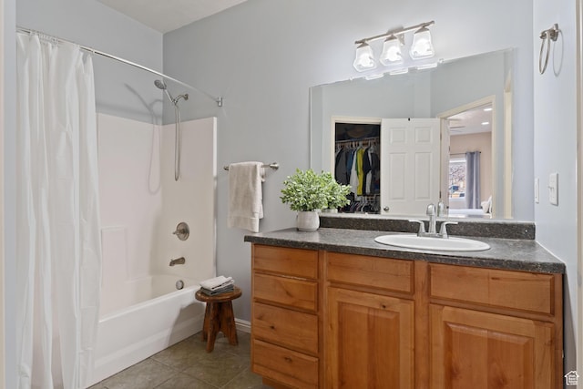 7112 N Mohican Dr E, Eagle Mountain, UT 84005 - bathroom featuring tile patterned floors, vanity, and shower / tub combo