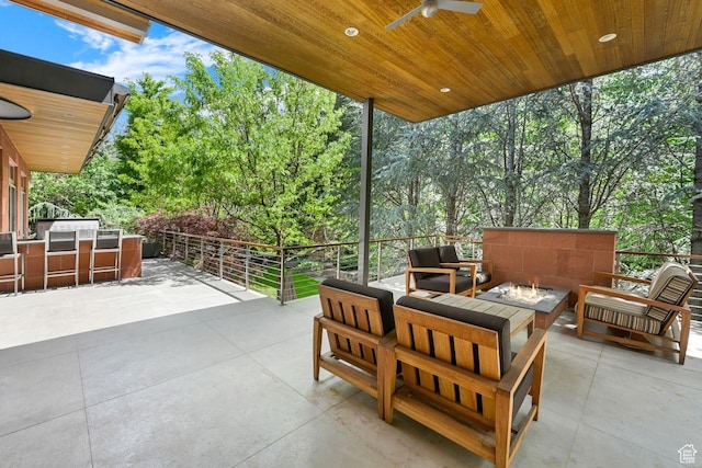 1762 E Millcreek Way, Millcreek, UT 84106 - view of patio / terrace featuring an outdoor living space with a fire pit, an outdoor kitchen, ceiling fan, and view of scattered trees