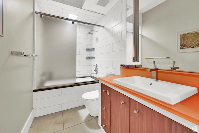 1762 E Millcreek Way, Millcreek, UT 84106 - bathroom with tile patterned flooring, tiled shower / bath, toilet, vanity, and baseboards