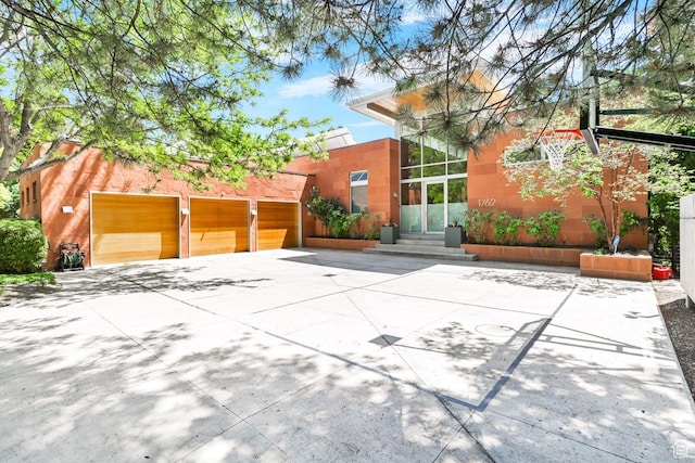 1762 E Millcreek Way, Millcreek, UT 84106 - view of side of property with concrete driveway and entry steps