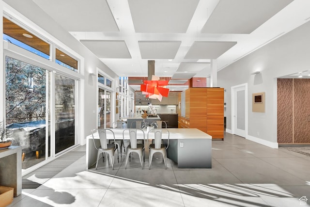 1762 E Millcreek Way, Millcreek, UT 84106 - dining area featuring coffered ceiling, baseboards, and beam ceiling