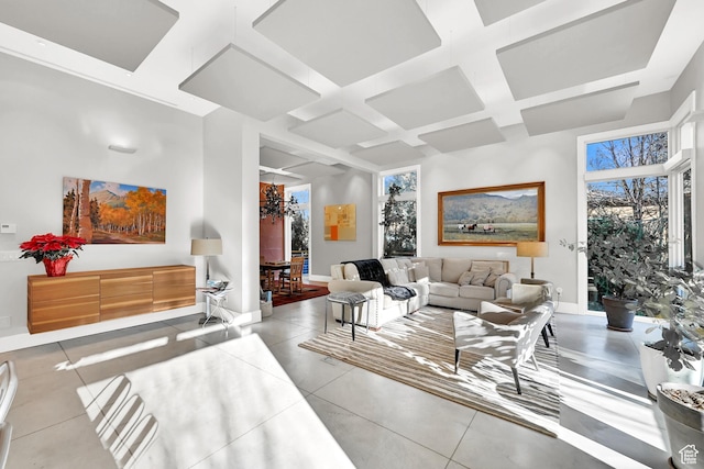 1762 E Millcreek Way, Millcreek, UT 84106 - tiled living room featuring coffered ceiling, beam ceiling, and baseboards
