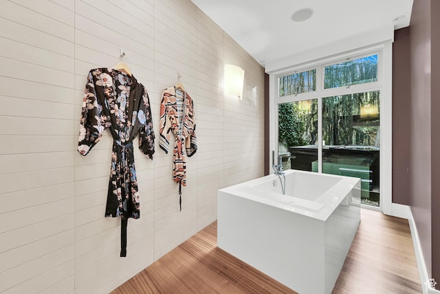 1762 E Millcreek Way, Millcreek, UT 84106 - bathroom featuring wood finished floors and a freestanding tub