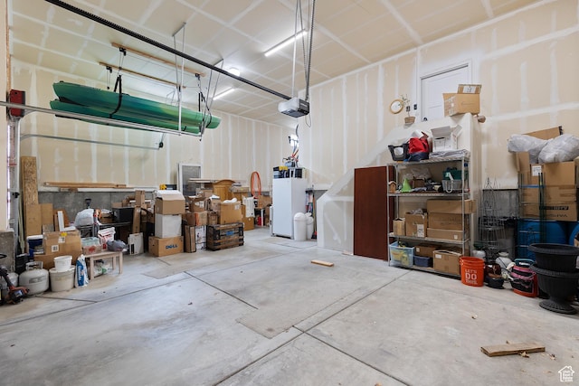 536 W Granite Cir, Saratoga Springs, UT 84045 - garage with refrigerator and a garage door opener