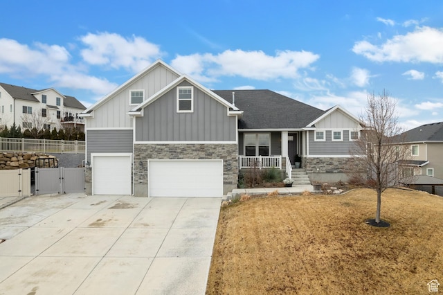 536 W Granite Cir, Saratoga Springs, UT 84045 - craftsman house featuring a gate, board and batten siding, fence, and covered porch