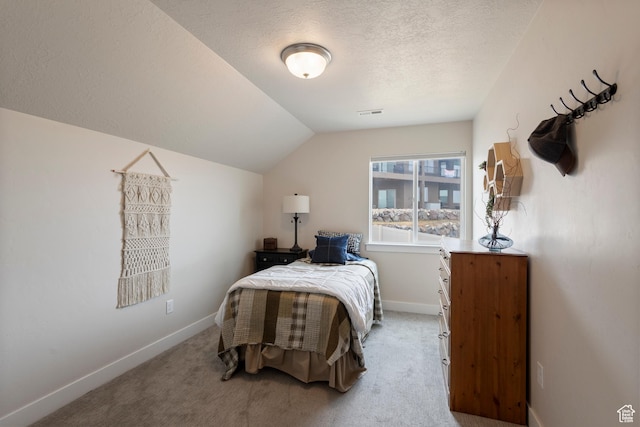 536 W Granite Cir, Saratoga Springs, UT 84045 - bedroom with baseboards, vaulted ceiling, a textured ceiling, and light colored carpet