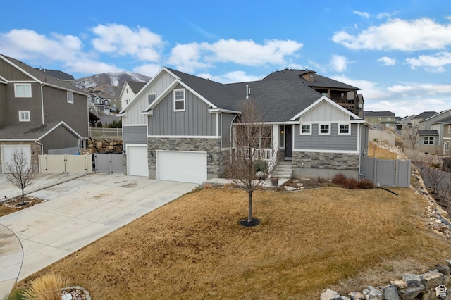 536 W Granite Cir, Saratoga Springs, UT 84045 - view of front of house featuring a gate, board and batten siding, and stone siding