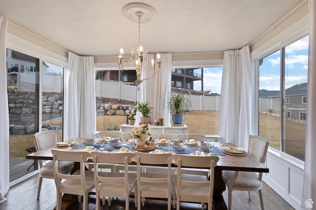 536 W Granite Cir, Saratoga Springs, UT 84045 - dining space featuring a chandelier, a wealth of natural light, and hardwood / wood-style flooring