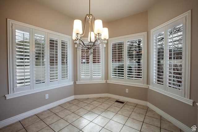 2783 S Irene Dr E, Bountiful, UT 84010 - unfurnished dining area featuring light tile patterned flooring, a notable chandelier, baseboards, and visible vents