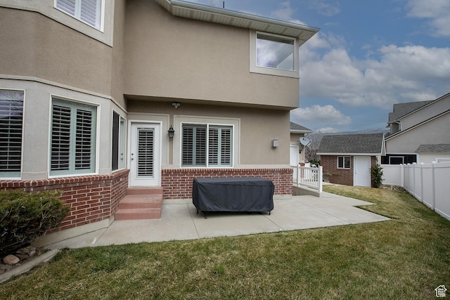 2783 S Irene Dr E, Bountiful, UT 84010 - rear view of property featuring a patio, brick siding, fence, and a lawn