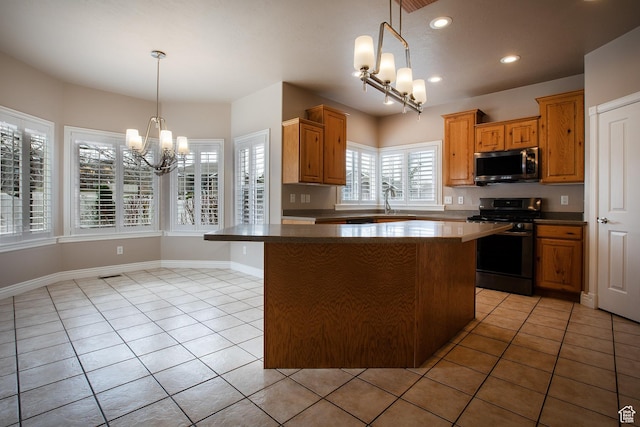 2783 S Irene Dr E, Bountiful, UT 84010 - kitchen with light tile patterned floors, a center island, stainless steel appliances, and a chandelier
