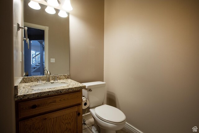 2783 S Irene Dr E, Bountiful, UT 84010 - bathroom featuring toilet, vanity, baseboards, and tile patterned flooring