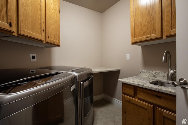 2783 S Irene Dr E, Bountiful, UT 84010 - laundry area featuring light tile patterned floors, baseboards, a sink, cabinet space, and washing machine and dryer