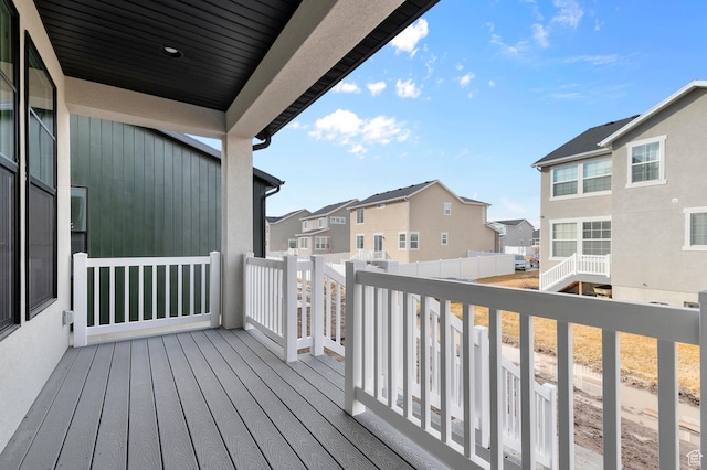 wooden deck with a residential view