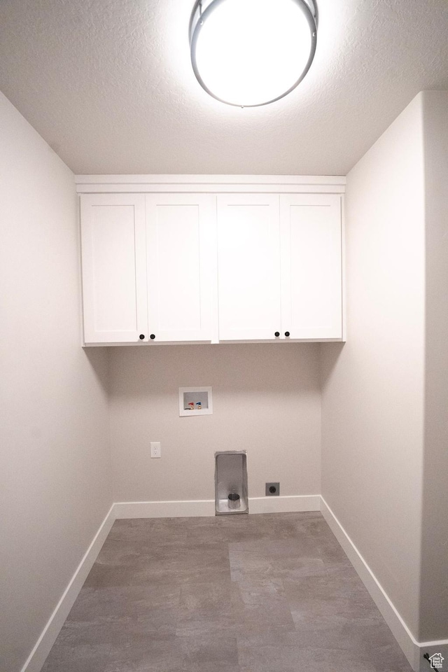 573 N 510 E Unit 20, Smithfield, UT 84335 - laundry area featuring baseboards, a textured ceiling, hookup for a washing machine, cabinet space, and hookup for an electric dryer