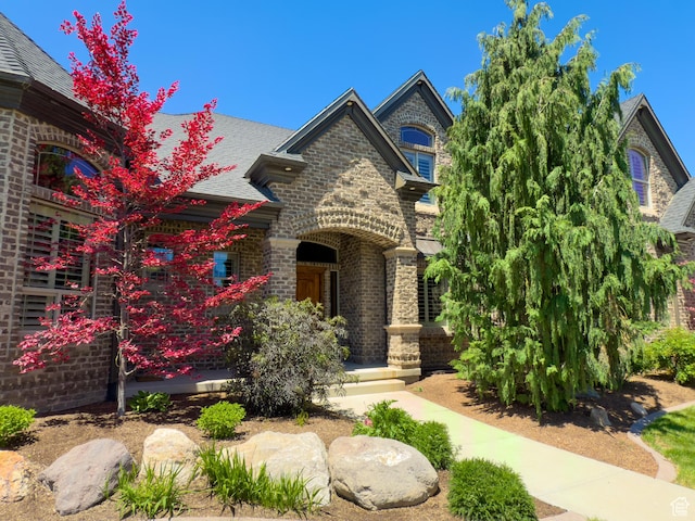 11278 S Portobello Rd W, South Jordan, UT 84095 - view of front of house with brick siding and roof with shingles
