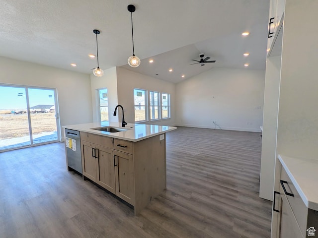 kitchen featuring sink, pendant lighting, dishwasher, dark hardwood / wood-style floors, and an island with sink