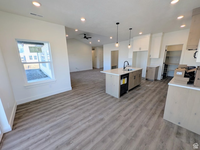 kitchen with dishwasher, sink, ceiling fan, an island with sink, and decorative light fixtures