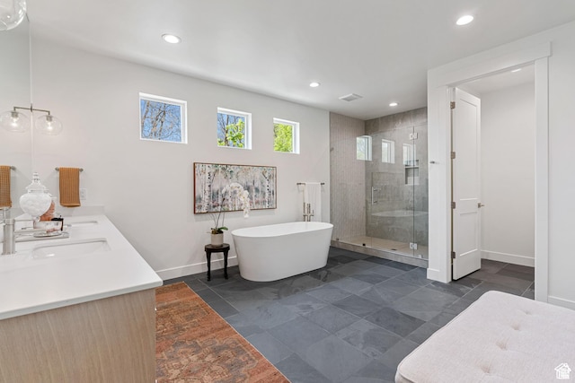 bathroom with separate shower and tub and vanity