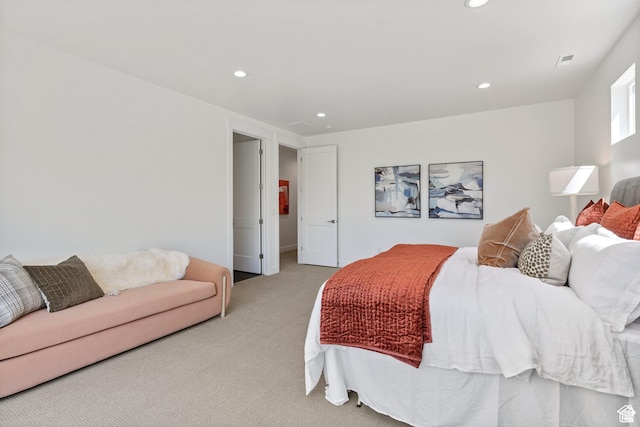 bedroom with light colored carpet