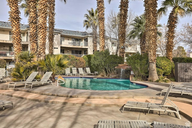 view of swimming pool with a patio area and pool water feature