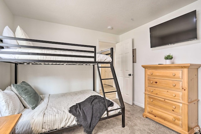 bedroom with light carpet