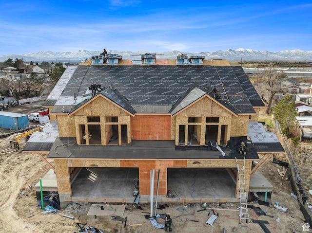 rear view of property featuring a mountain view