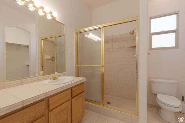 2365 E 160 S, St George, UT 84790 - bathroom featuring tile patterned flooring, vanity, toilet, and walk in shower