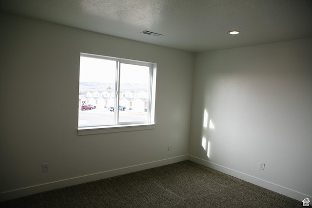 empty room featuring carpet flooring