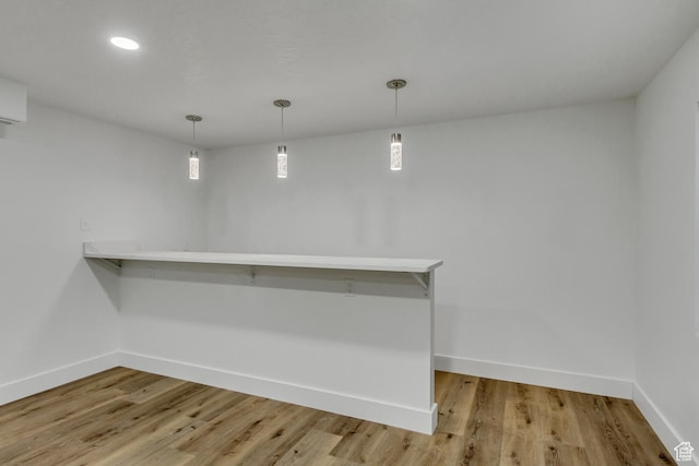 12756 S Diamond Back Dr W, Riverton, UT 84096 - interior space featuring light wood-type flooring and decorative light fixtures