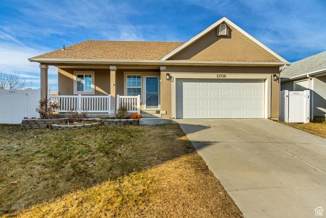 12756 S Diamond Back Dr W, Riverton, UT 84096 - view of front of property with covered porch, a garage, and a front lawn