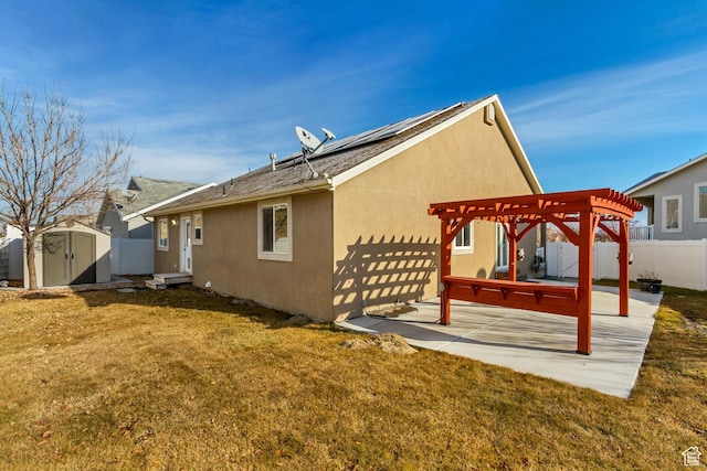 12756 S Diamond Back Dr W, Riverton, UT 84096 - rear view of house featuring solar panels, a pergola, a patio, and a yard