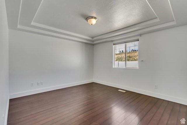 12756 S Diamond Back Dr W, Riverton, UT 84096 - unfurnished room featuring dark hardwood / wood-style floors and a tray ceiling