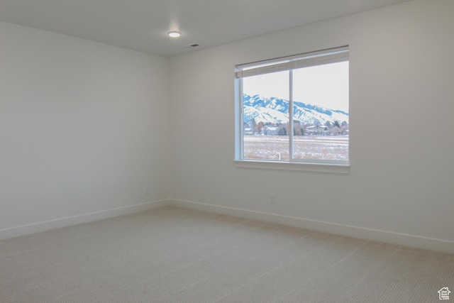 626 E 2450 N, North Logan, UT 84341 - spare room with light carpet, baseboards, plenty of natural light, and a mountain view