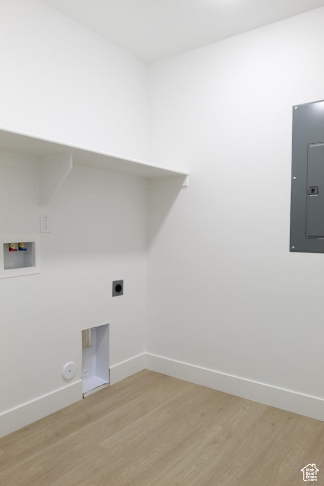 626 E 2450 N, North Logan, UT 84341 - washroom with electric panel, light wood-type flooring, hookup for a washing machine, and baseboards
