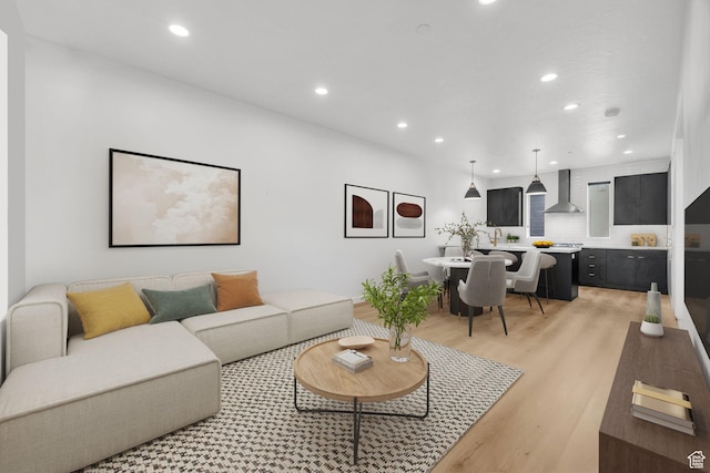 living area featuring recessed lighting and light wood-type flooring
