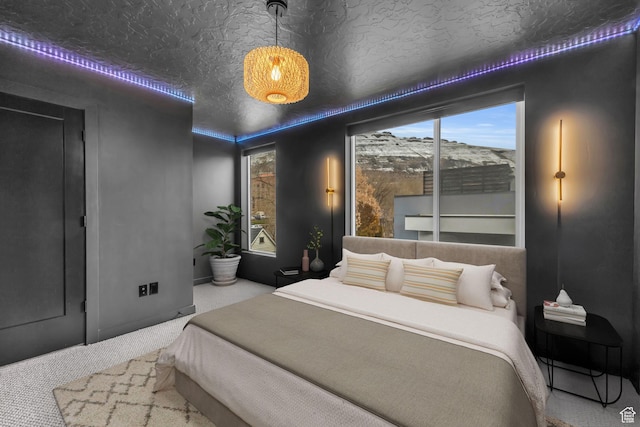 bedroom with carpet and a textured ceiling
