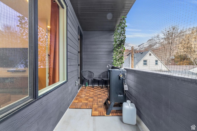 view of patio featuring a balcony