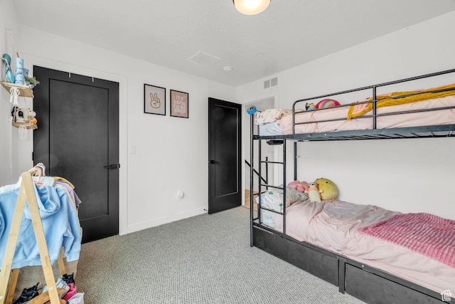 bedroom with carpet flooring, baseboards, and visible vents