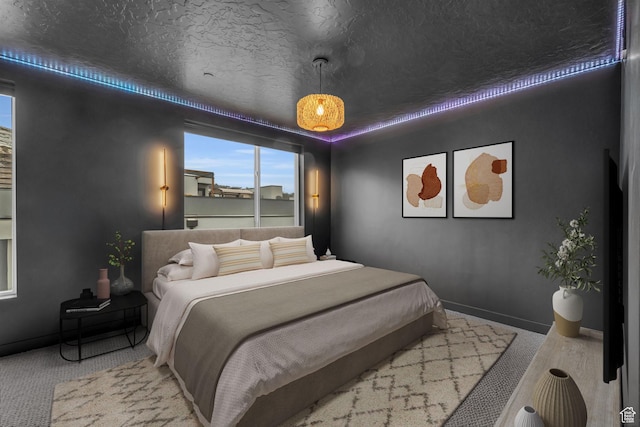 bedroom with carpet flooring and baseboards