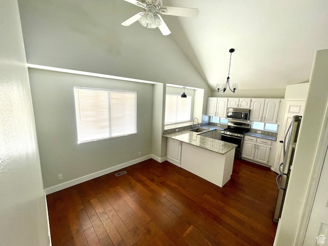 1668 N Lewis And Clark Dr, Centerville, UT 84014 - kitchen featuring dark wood finished floors, a peninsula, stainless steel appliances, white cabinetry, and a sink
